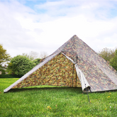DD Pyramid Tent in camouflage setup on green grass, ideal for outdoor shelter and camping with DD Hammocks.